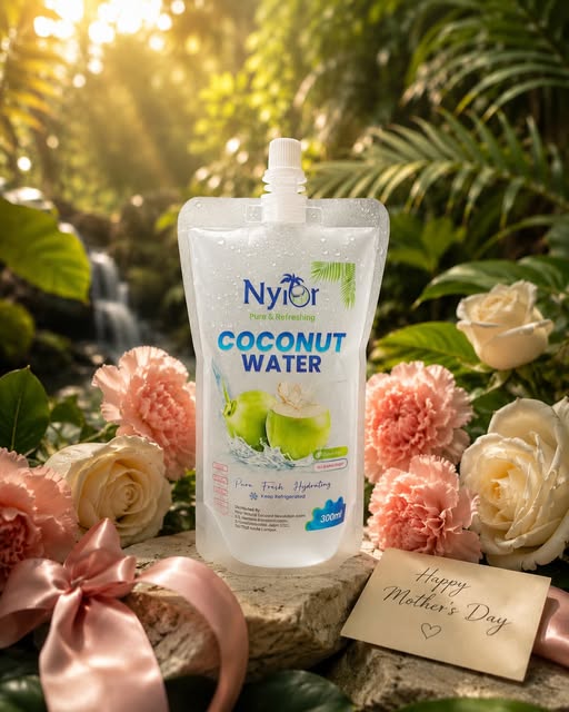 Nyior coconut water pouch styled with flowers for a gifting occasion